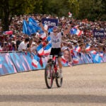 Haley Batten, of United States, celebrates her second place in the women's mountain bike cycling event, at the 2024 Summer Olympics, Sunday, July 28, 2024, in Elancourt, France.