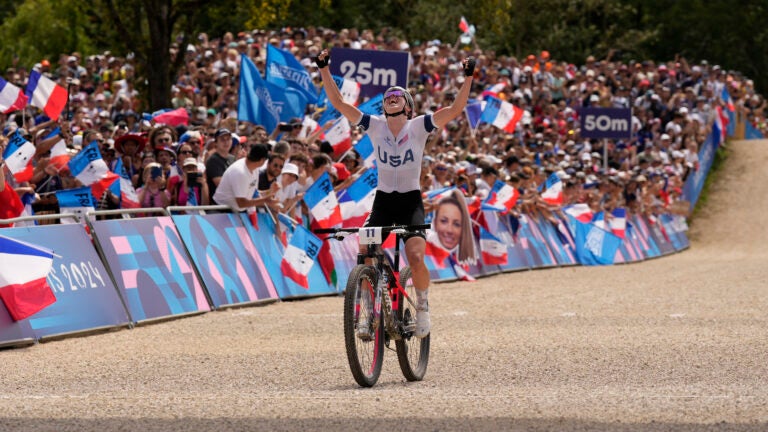 Haley Batten, of United States, celebrates her second place in the women's mountain bike cycling event, at the 2024 Summer Olympics, Sunday, July 28, 2024, in Elancourt, France.