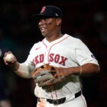 Red Sox third baseman Rafael Devers smiles after catching the final out, a flyout by Oakland Athletics' Lawrence Butler, at Fenway Park, Tuesday, July 9, 2024.