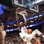 United States center Bam Adebayo dunks during the first half of an exhibition basketball game against Canada.