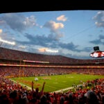 Fans cheer at Arrowhead Stadium during the first half of an NFL football game between the Kansas City Chiefs and the Detroit Lions.