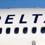 A Delta Air Lines jetliner is shown at Denver International Airport.