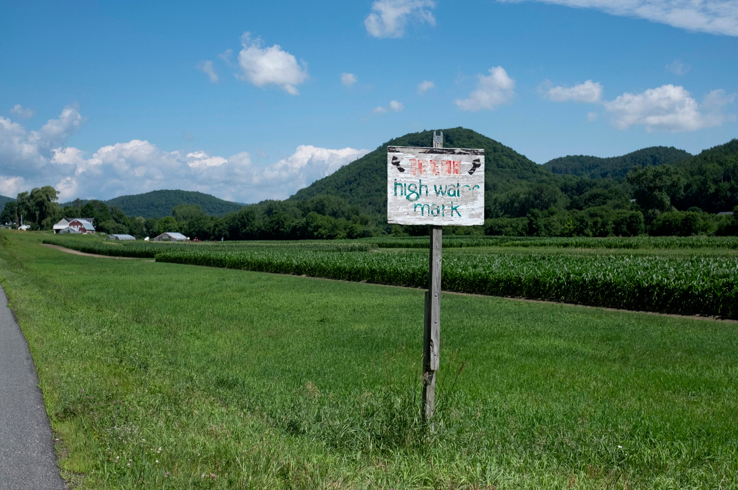 A weathered sign on the edge of a farm known as Hurricane Flats shows the high water mark that Hurricane Irene achieved in 2011.