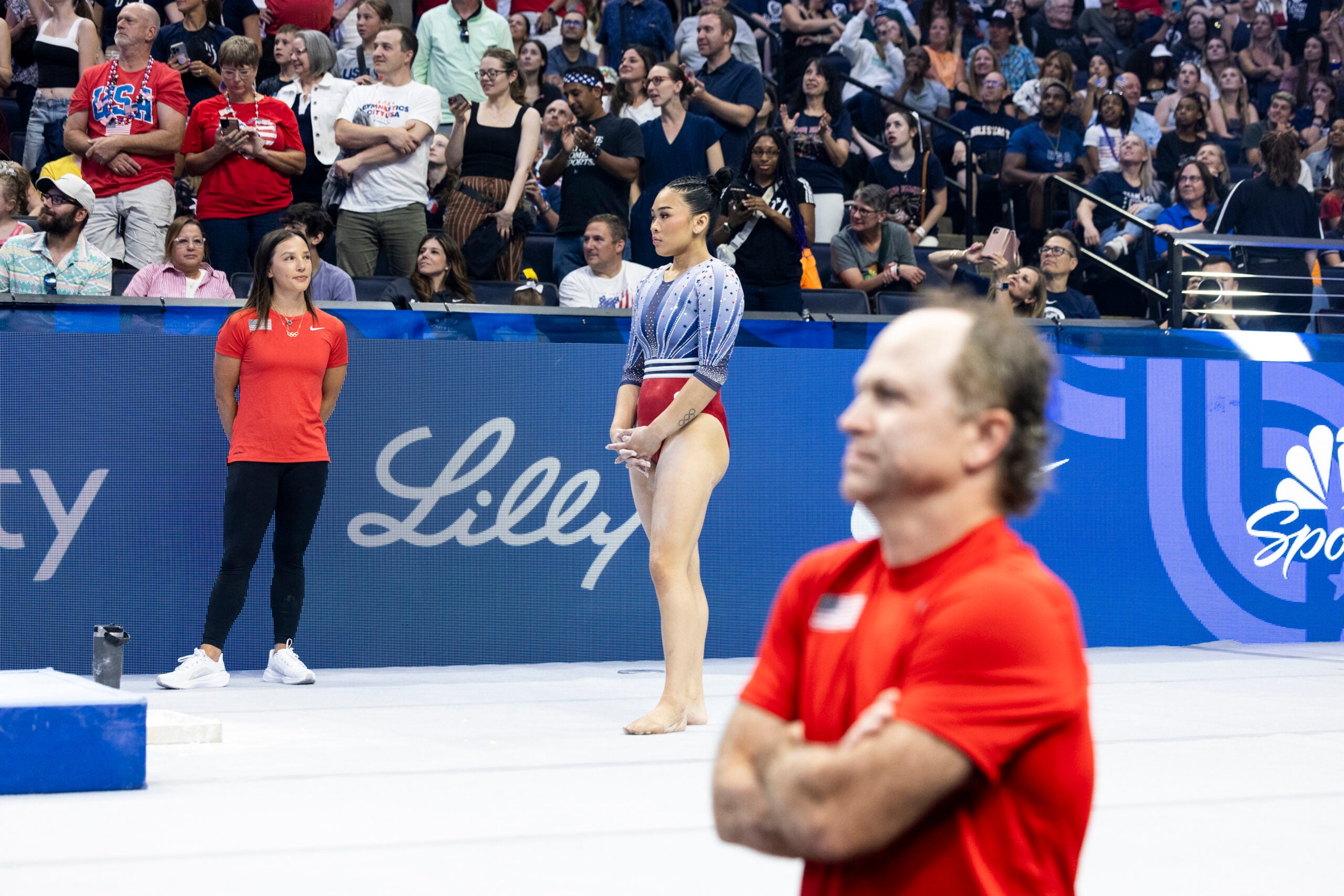 Sunisa Lee with her coaches Alison Lim, left, and Jess Graba, right, during the Olympics gymnastics trials in Minneapolis.