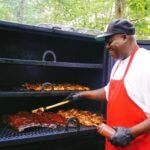 Chef David Wade cooking barbecue on a smoker.