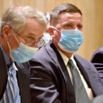 Former superintendent of the Soldiers' Home in Holyoke, Bennett Walsh, right, listened to testimony during a hearing in Hampden Superior Court in 2021.