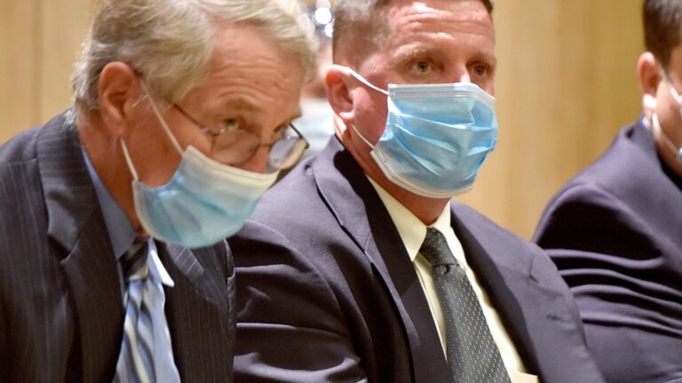 Former superintendent of the Soldiers' Home in Holyoke, Bennett Walsh, right, listened to testimony during a hearing in Hampden Superior Court in 2021.