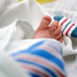 The toes of a baby peek out of a blanket at a hospital in McAllen, Texas.