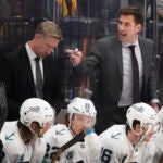 Seattle Kraken assistant coach Jay Leach, right, yells to players in the second period of an NHL hockey game against the Nashville Predators Thursday, Oct. 14, 2021, in Nashville, Tenn.