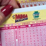 A Mega Millions wagering slip in someone's hand.