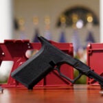 FILE - A 9mm ghost gun pistol build kit with a commercial slide and barrel with a polymer frame is displayed in the Rose Garden of the White House, April 11, 2022, in Washington. Massachusetts Gov. Maura Healey signed a sweeping gun bill into law Thursday, July 25, 2024, that supporters say builds on the state’s existing gun laws, including a crackdown on difficult to trace “ghost guns,” while safeguarding the rights of gun owners.