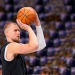 Boston Celtics center Kristaps Porzingis works out prior to Game 4 of the NBA basketball finals against the Dallas Mavericks, Friday, June 14, 2024, in Dallas.