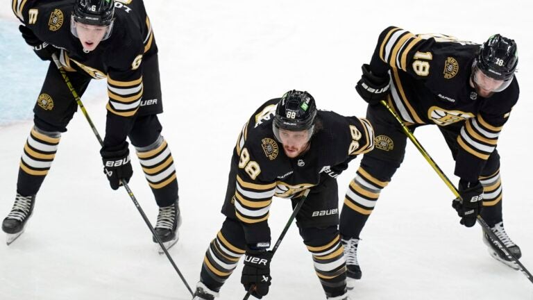 Boston Bruins' Mason Lohrei (6), David Pastrnak (88) and Pavel Zacha (18) play against the Pittsburgh Penguins during the third period of an NHL hockey game, Saturday, March 9, 2024, in Boston.