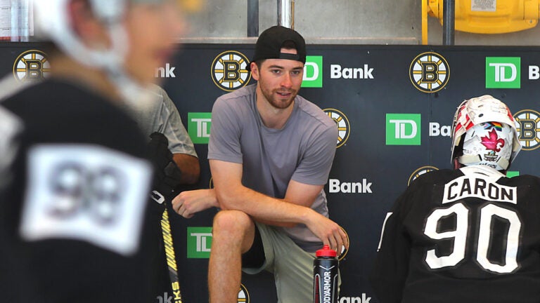 Boston-07/02/2024 The Boston Bruins held a development camp at Warrior Ice Arena. Bruins goalie Jeremy Swayman in shorts and a t-shirt looks on from the bench.