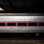 A photo of an MBTA commuter rail train passing by.