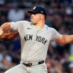 New York Yankees starting pitcher Carlos Rodón throws against the Red Sox during the first inning.