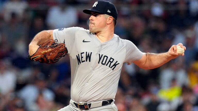 New York Yankees starting pitcher Carlos Rodón throws against the Red Sox during the first inning.